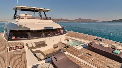 Christal Mio luxury yacht on deck with seating, hot tub, and panoramic windows