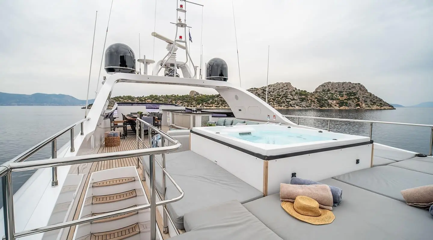 Pareaki II motor yacht at dock with flybridge, white hull, calm water
