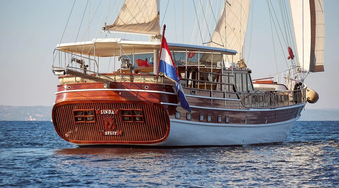 Linda luxury gulet sailing at sunset with wooden deck and sails