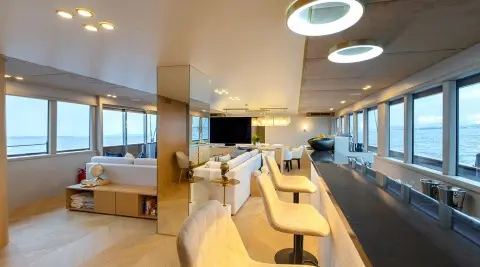 Luxurious yacht interior on Scorpios: sunlit main lounge with panoramic sea views