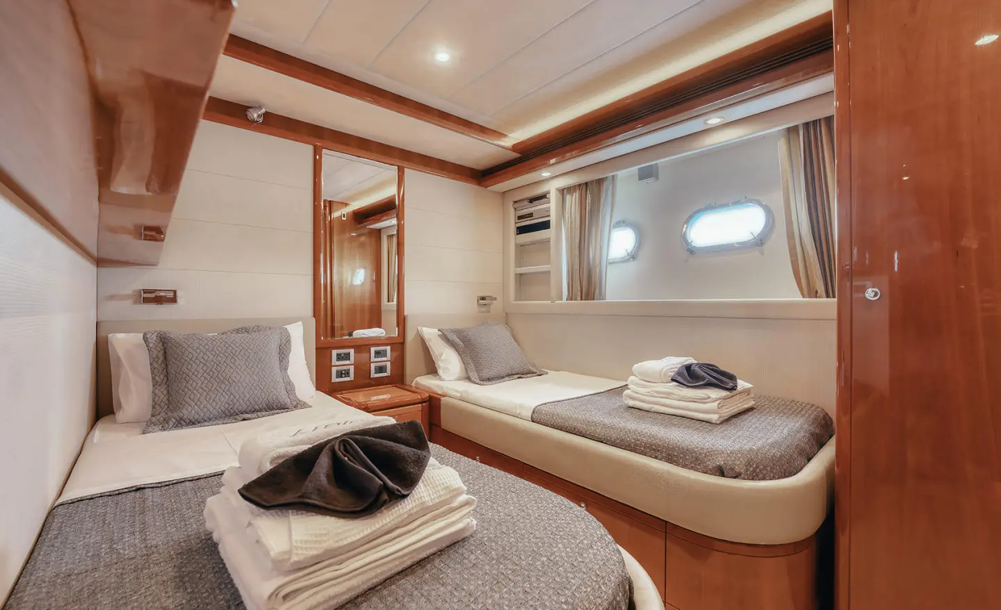 Interior of Lidia motor yacht with twin cabin and neatly made beds