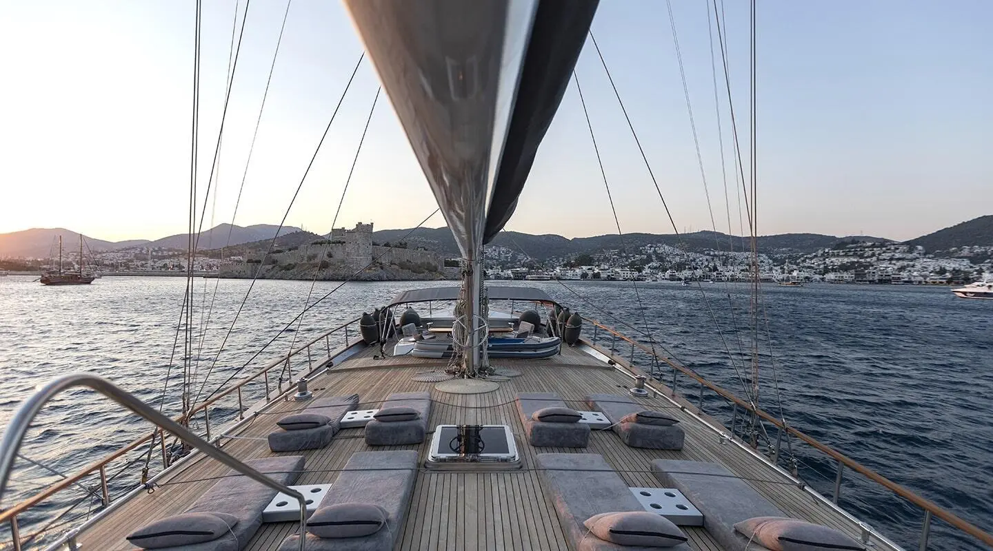 Photo of a luxury gulet yacht deck with sun loungers at sunset on Silver Moon
