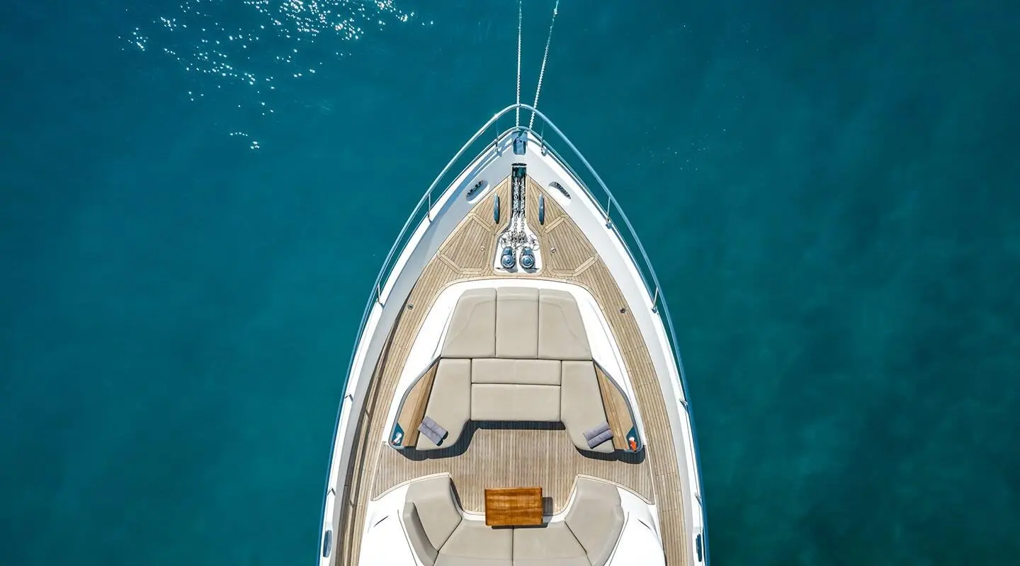 Vista motor yacht bow deck with seating area overlooking blue water