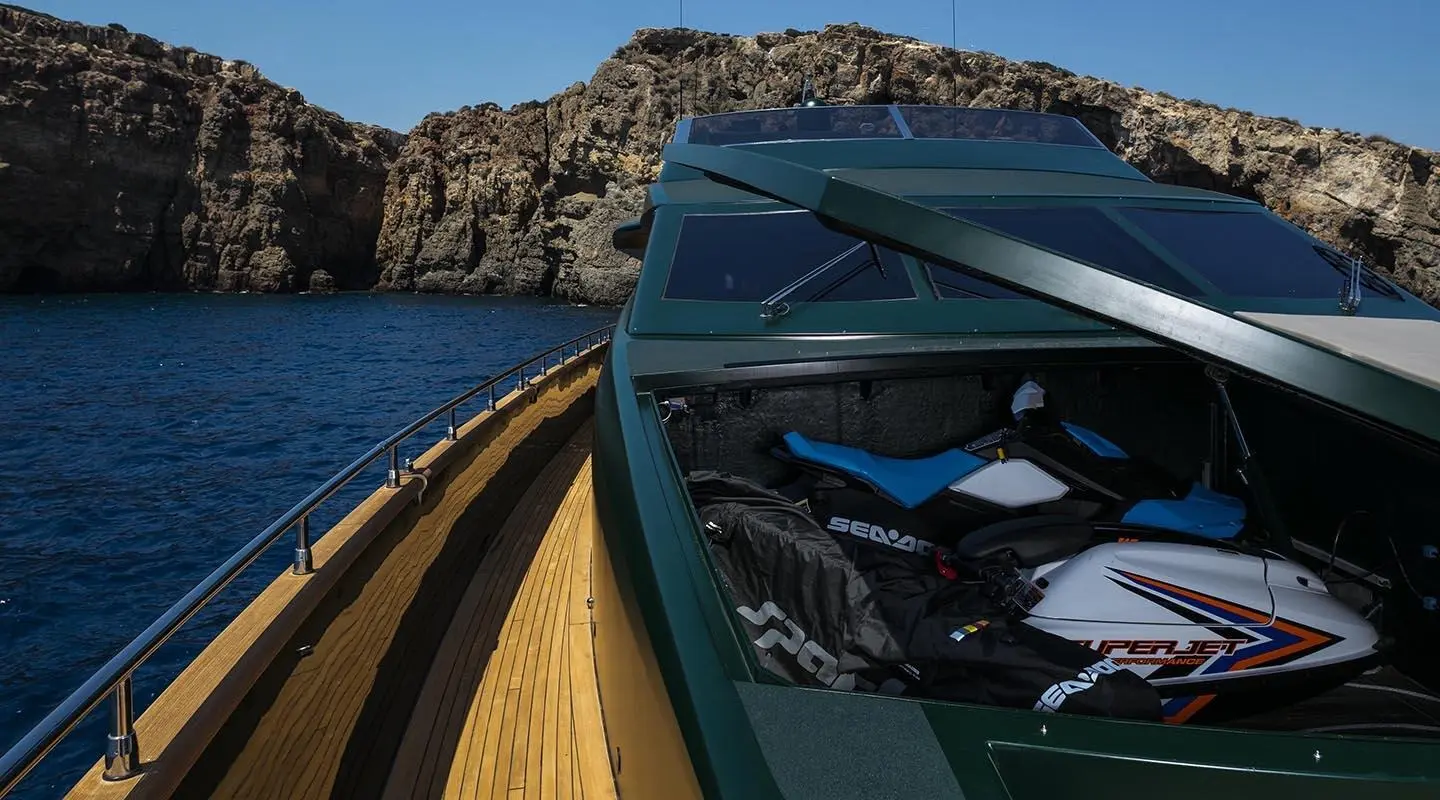 Yacht Cant Remember near rocky coastline, close-up bow and deck detailing