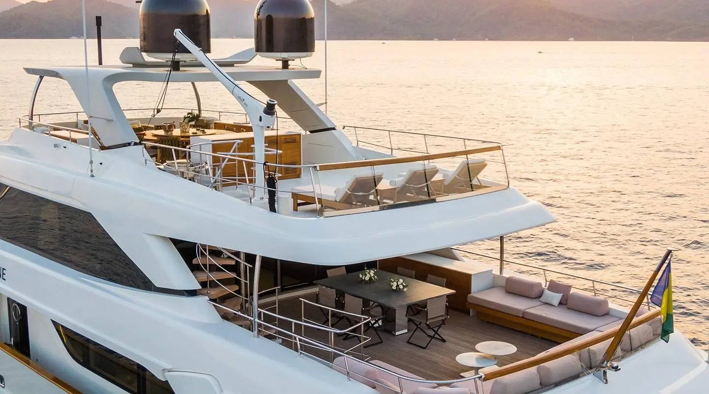 Takara One luxury motor yacht at sunset, multiple decks, calm sea