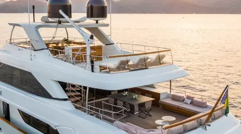 Takara One luxury motor yacht at sunset, multiple decks, calm sea
