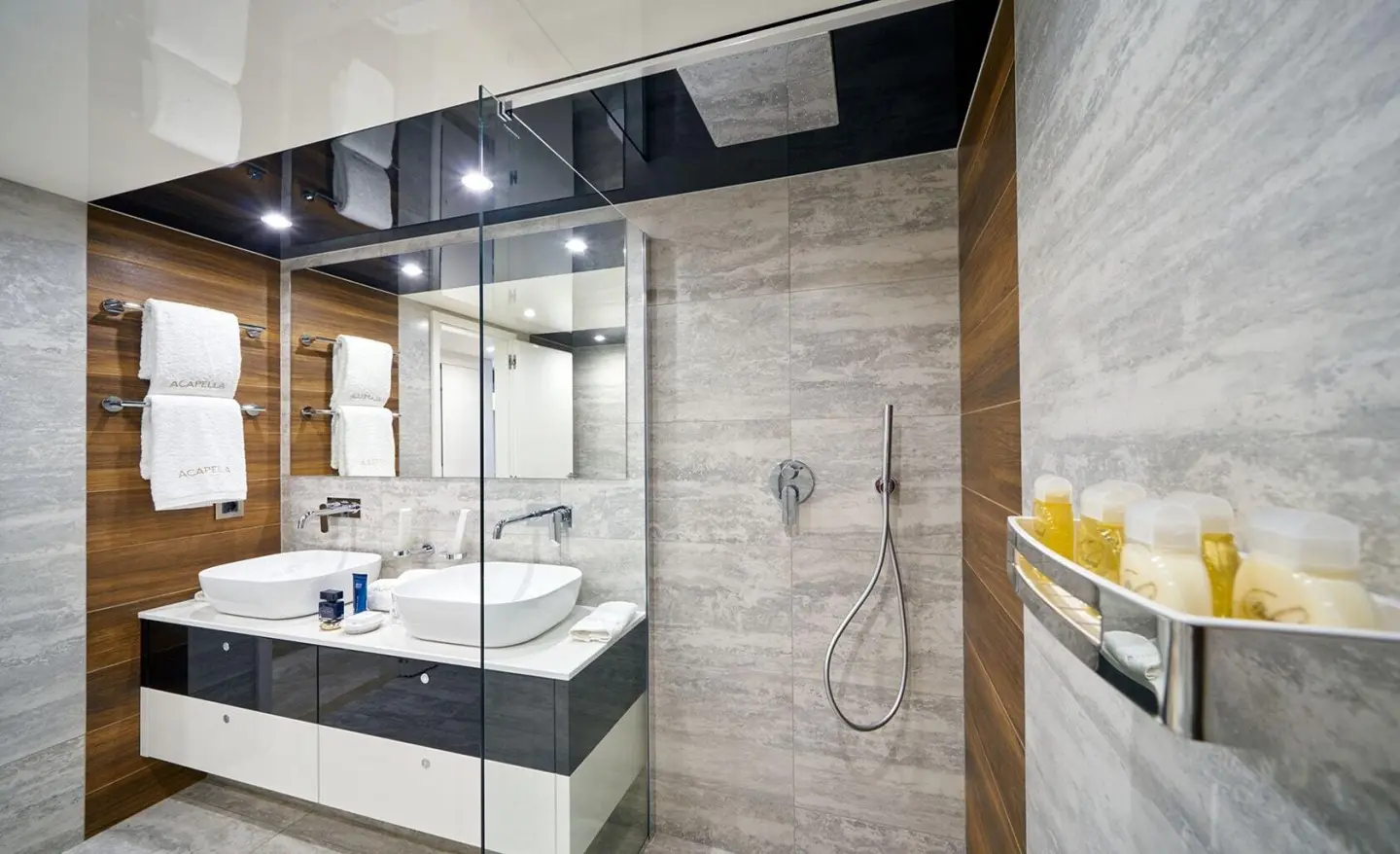 Acapella motor yacht bedroom and bathroom area with shower and sink visible