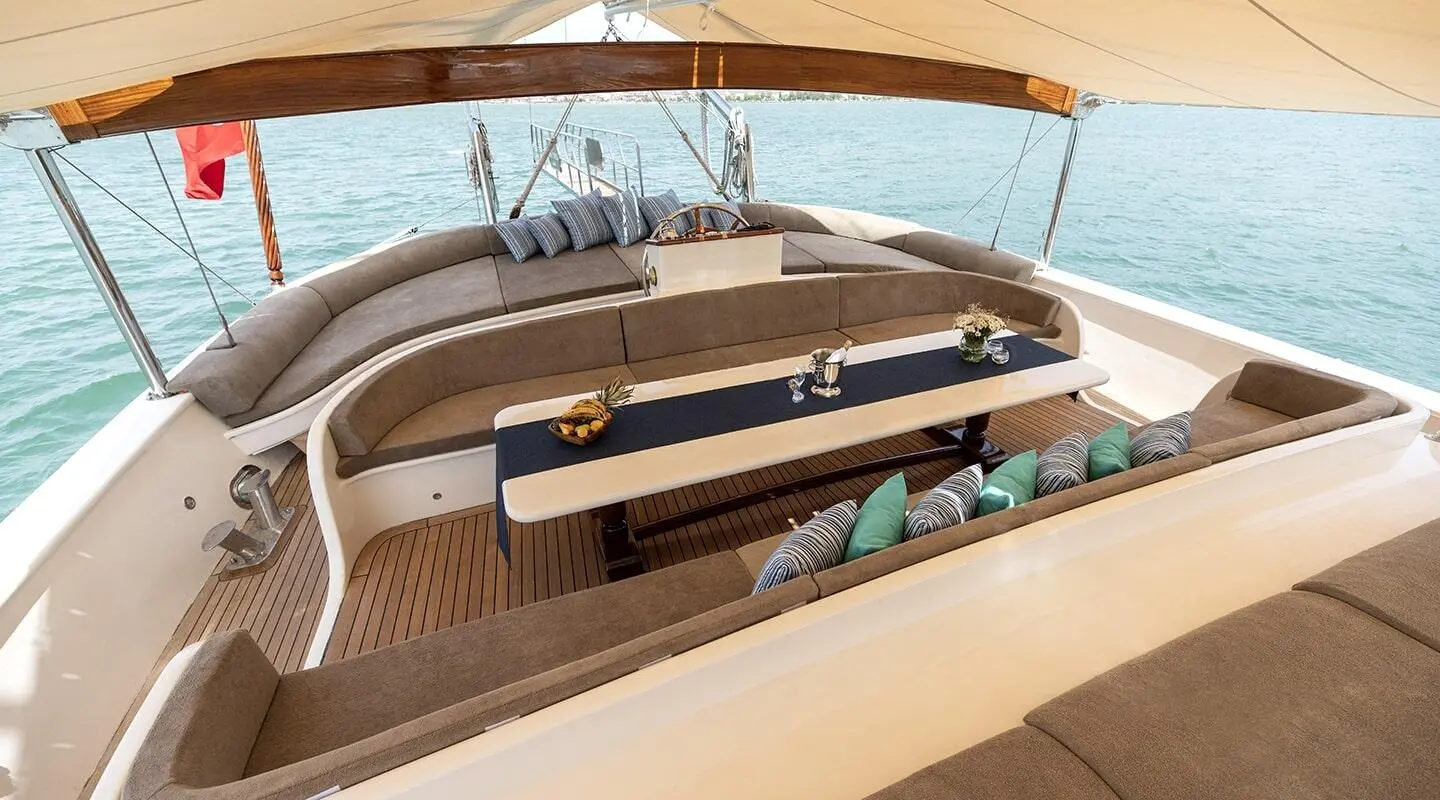 Kayhan Kaptan gulet lounge area with seating on wooden deck