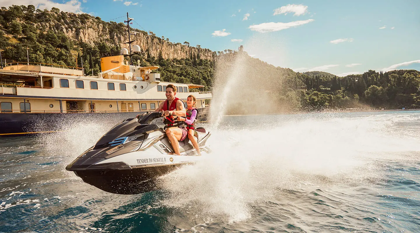 People Waterskiing beside the Seagull II yacht
