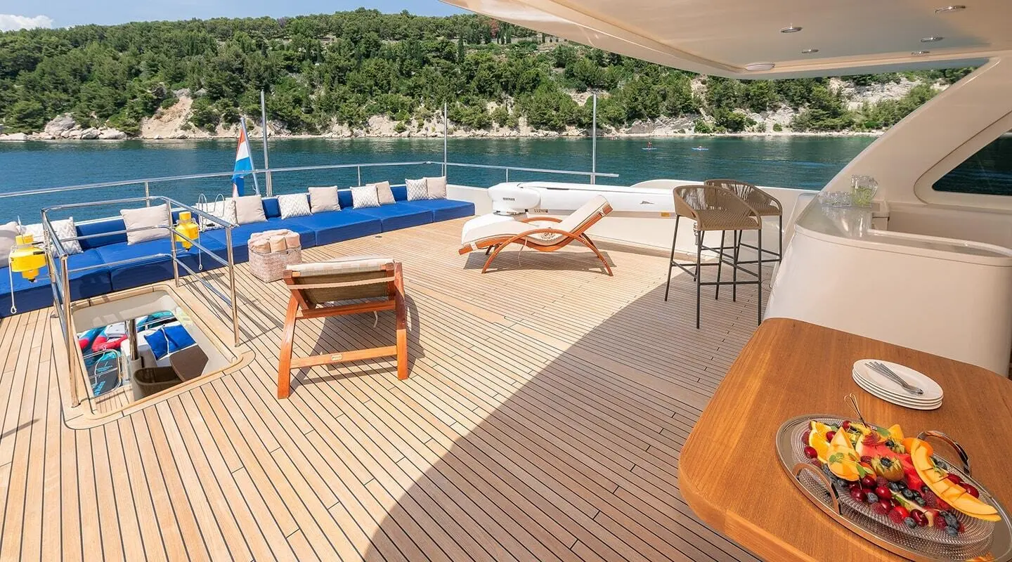 Grace yacht upper deck with seating, sun loungers, and shade sail