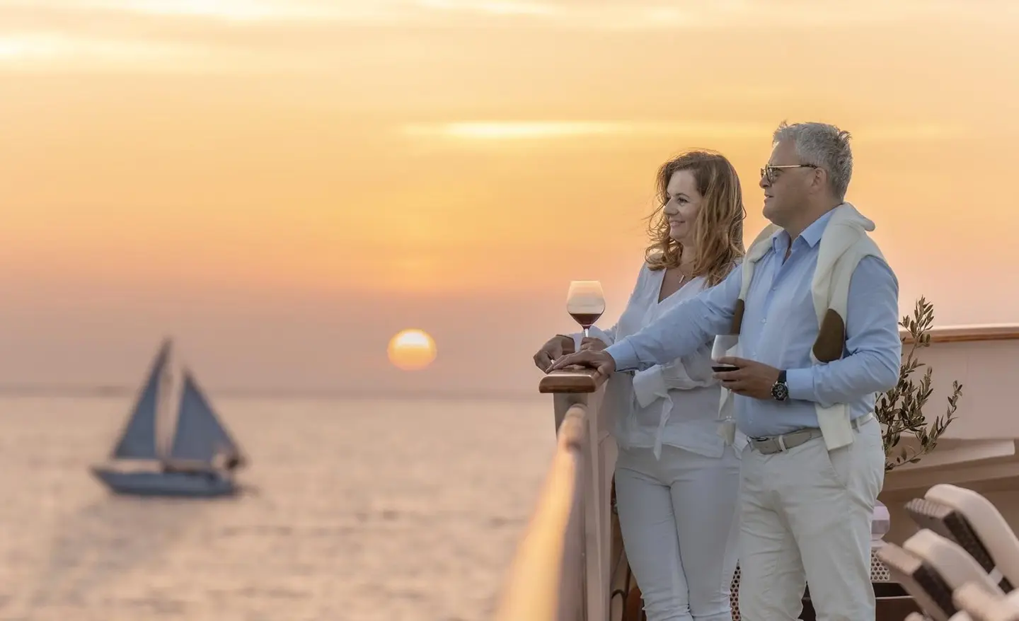 Karizma motor yacht at sunset in calm harbor with purple sky