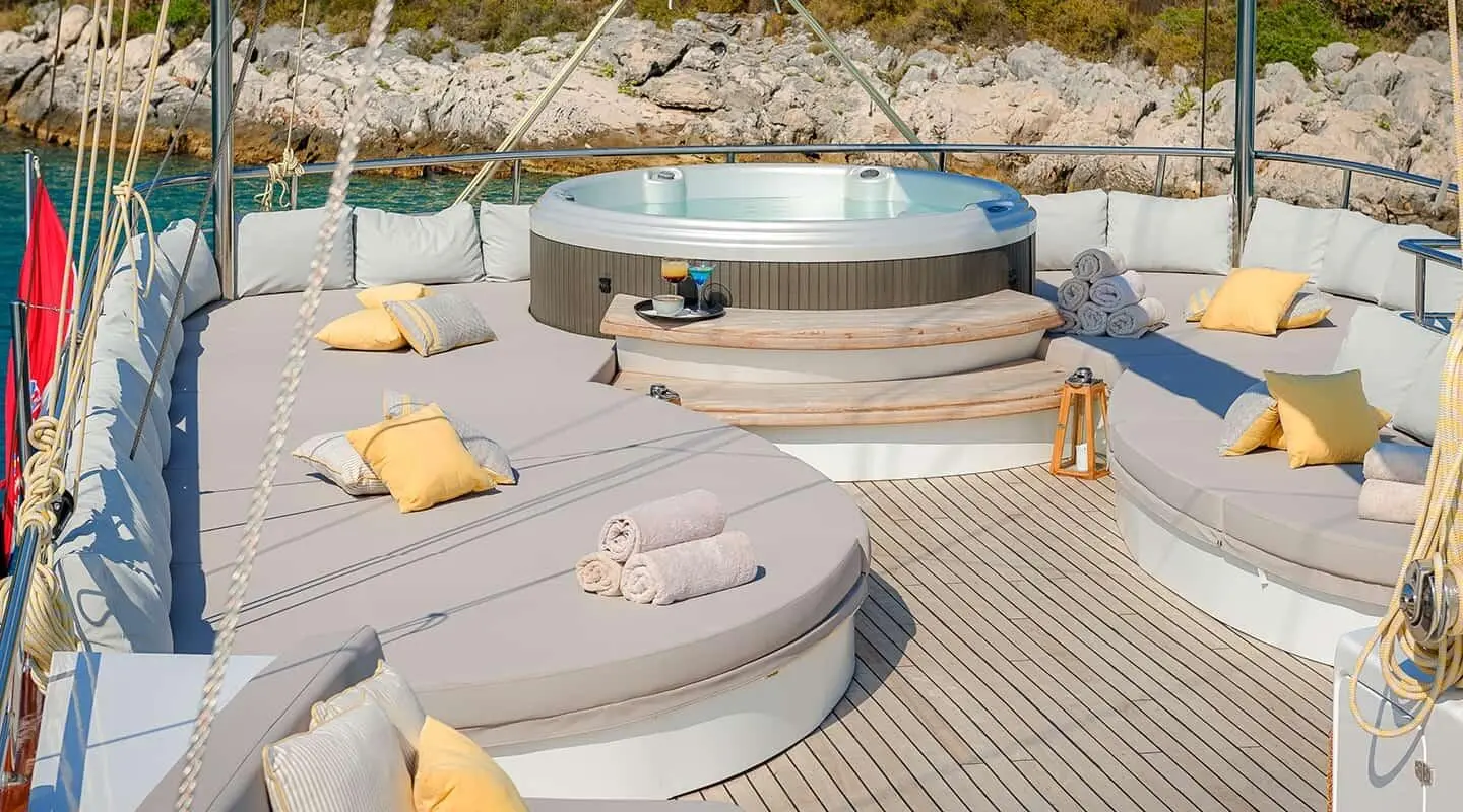 Lady Gita yacht exterior with jacuzzi on deck and sun loungers