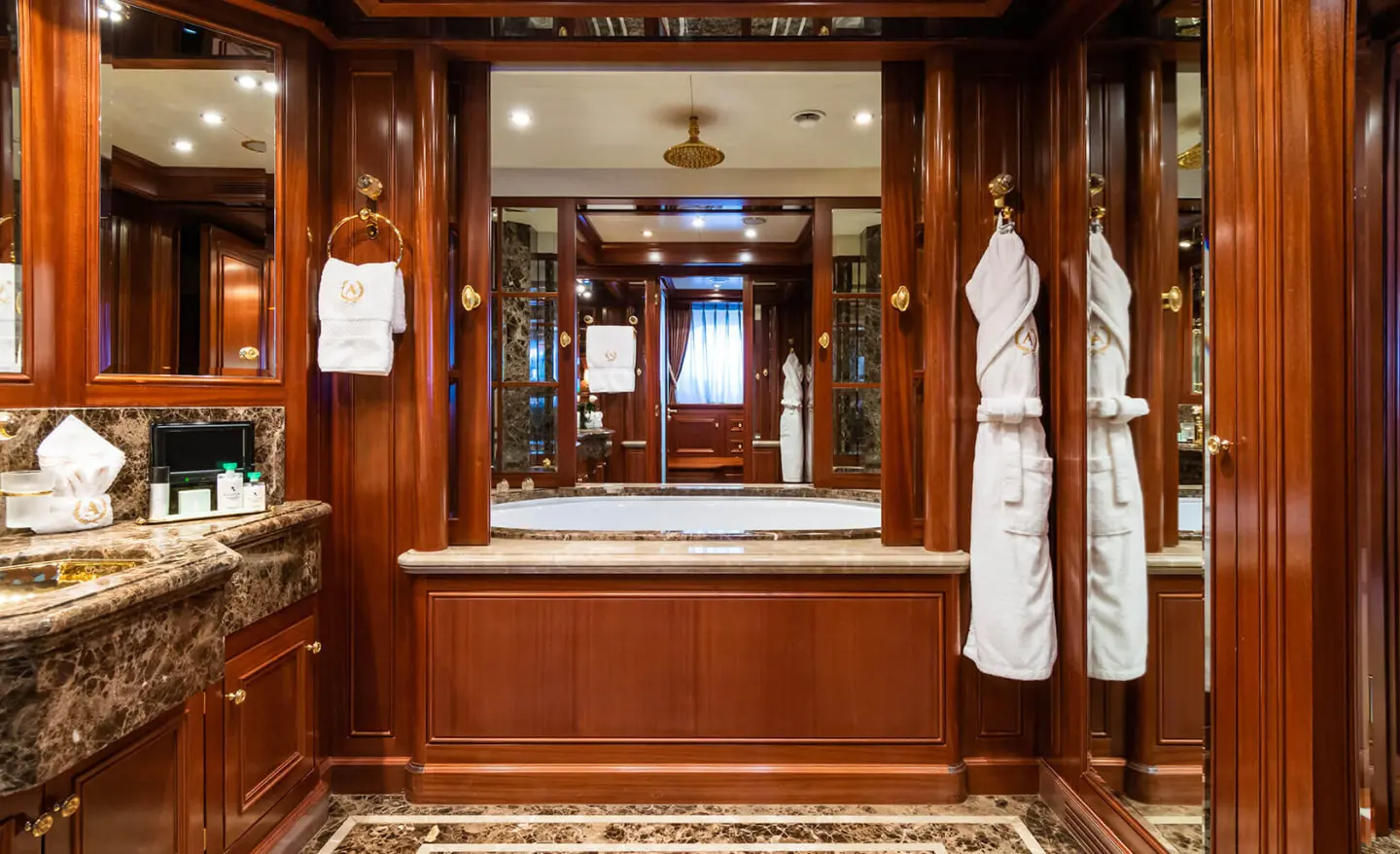 Exterior view of Apogee luxury yacht at sea, polished white hull and deck