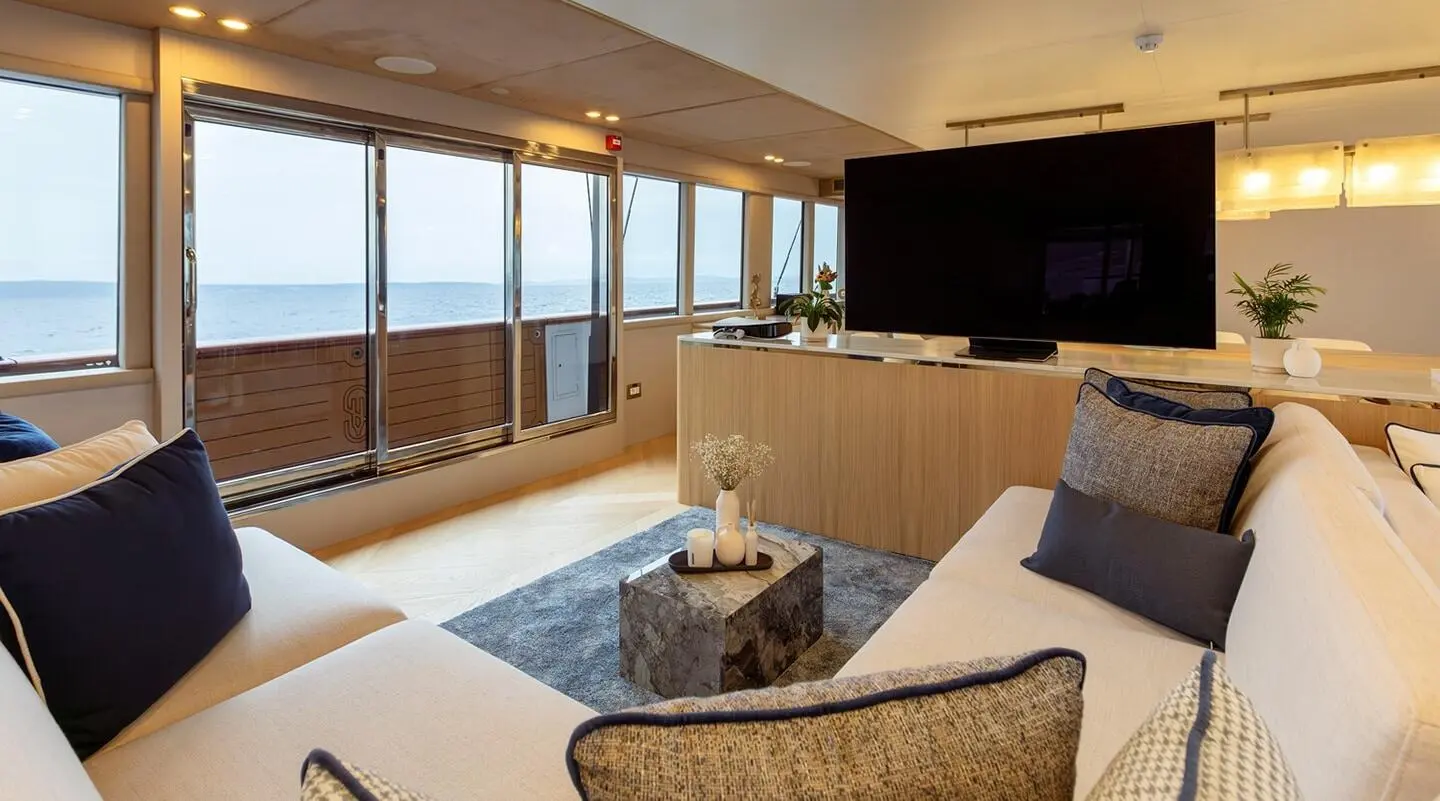 Scorpios yacht salon with light seating and large windows