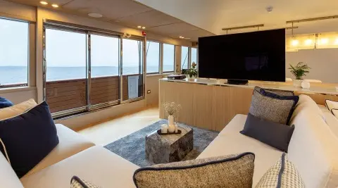 Scorpios yacht salon with light seating and large windows