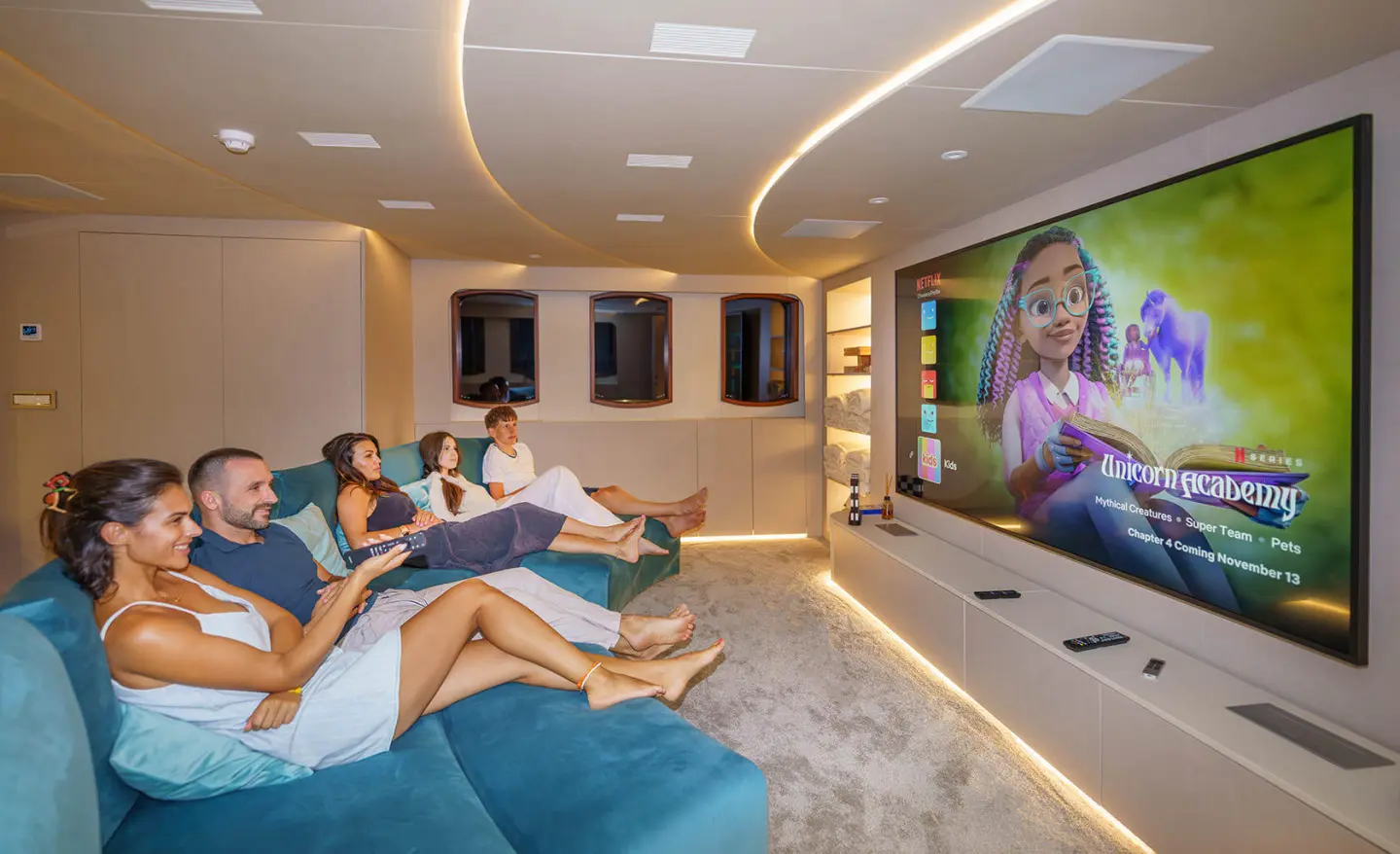 Maia yacht exterior deck interior with guests lounging in a modern lounge