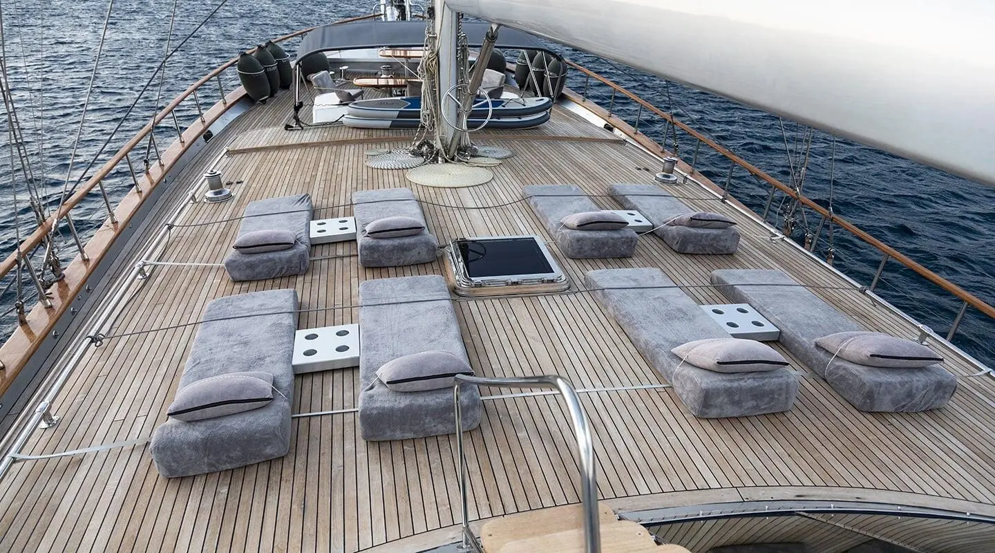 Sun deck with loungers and wooden deck on a yacht
