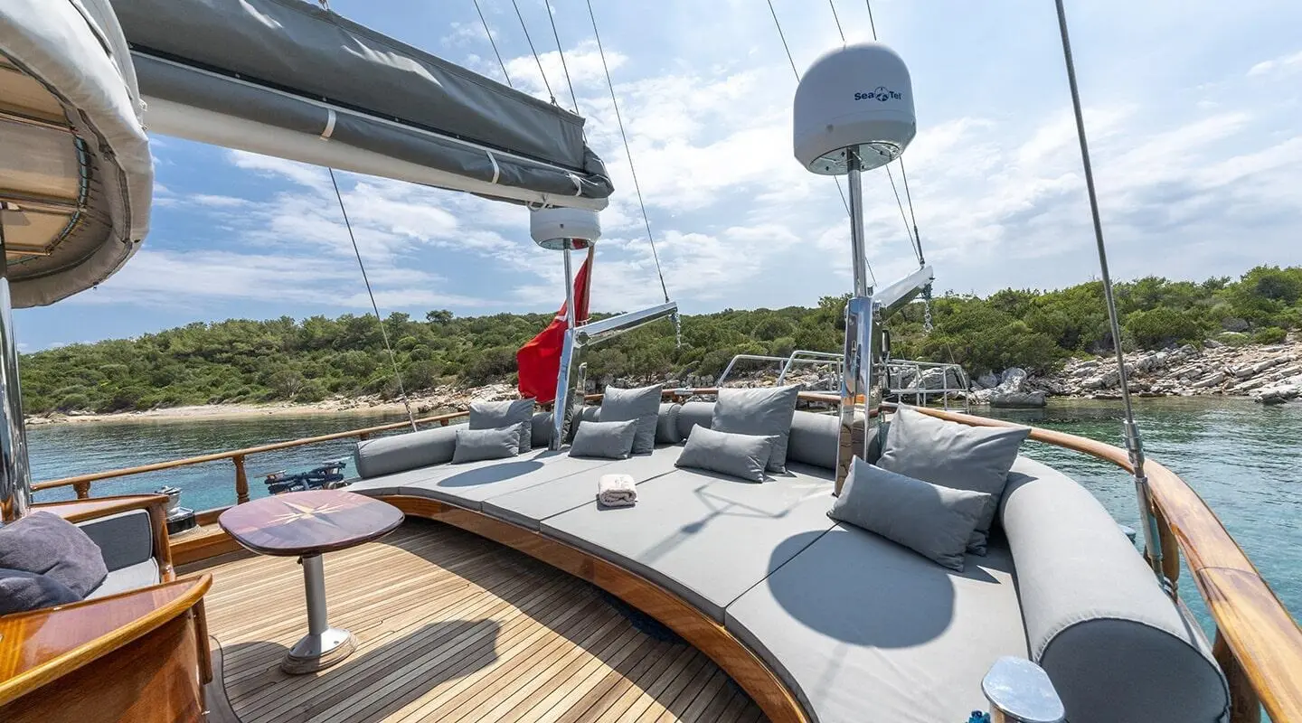 Yacht Bedia Sultan deck viewpoint with seating, white cushions, and calm blue sea