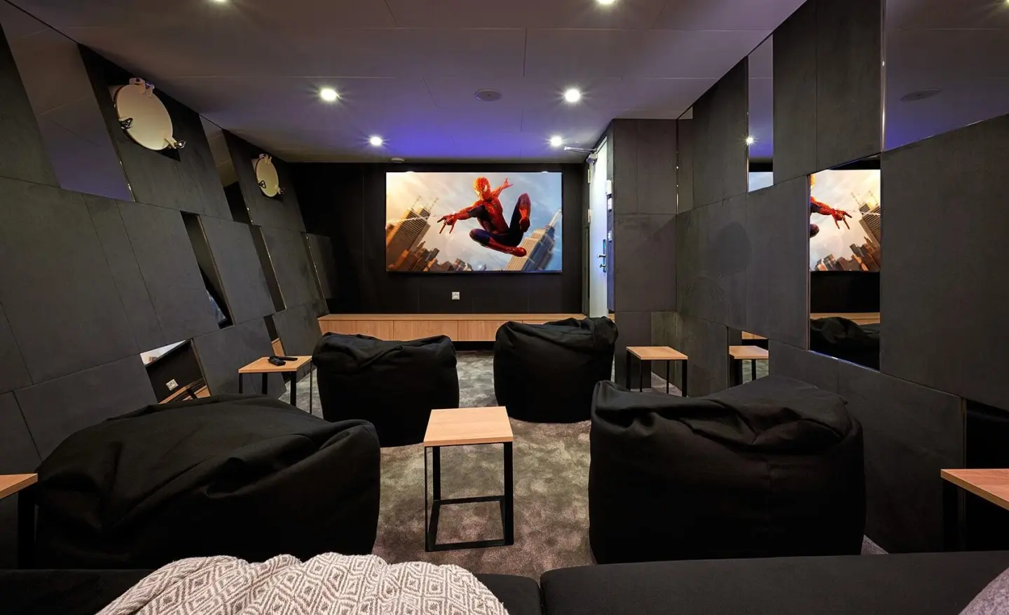 Ohana luxury yacht cinema room with multiple lounge seats facing a large screen
