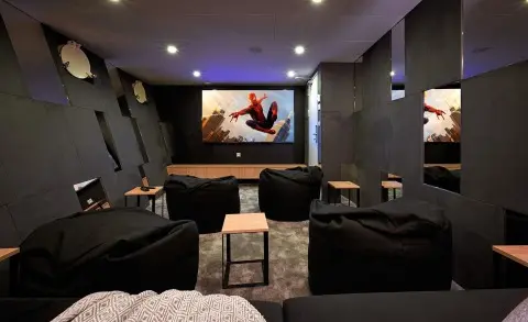 Ohana luxury yacht cinema room with multiple lounge seats facing a large screen
