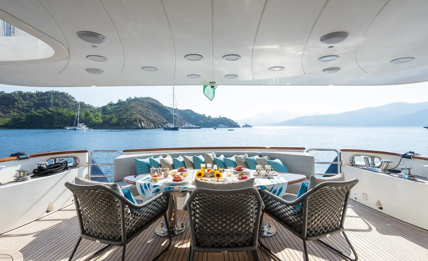 Amadea yacht aft deck dining area with seating and ocean view