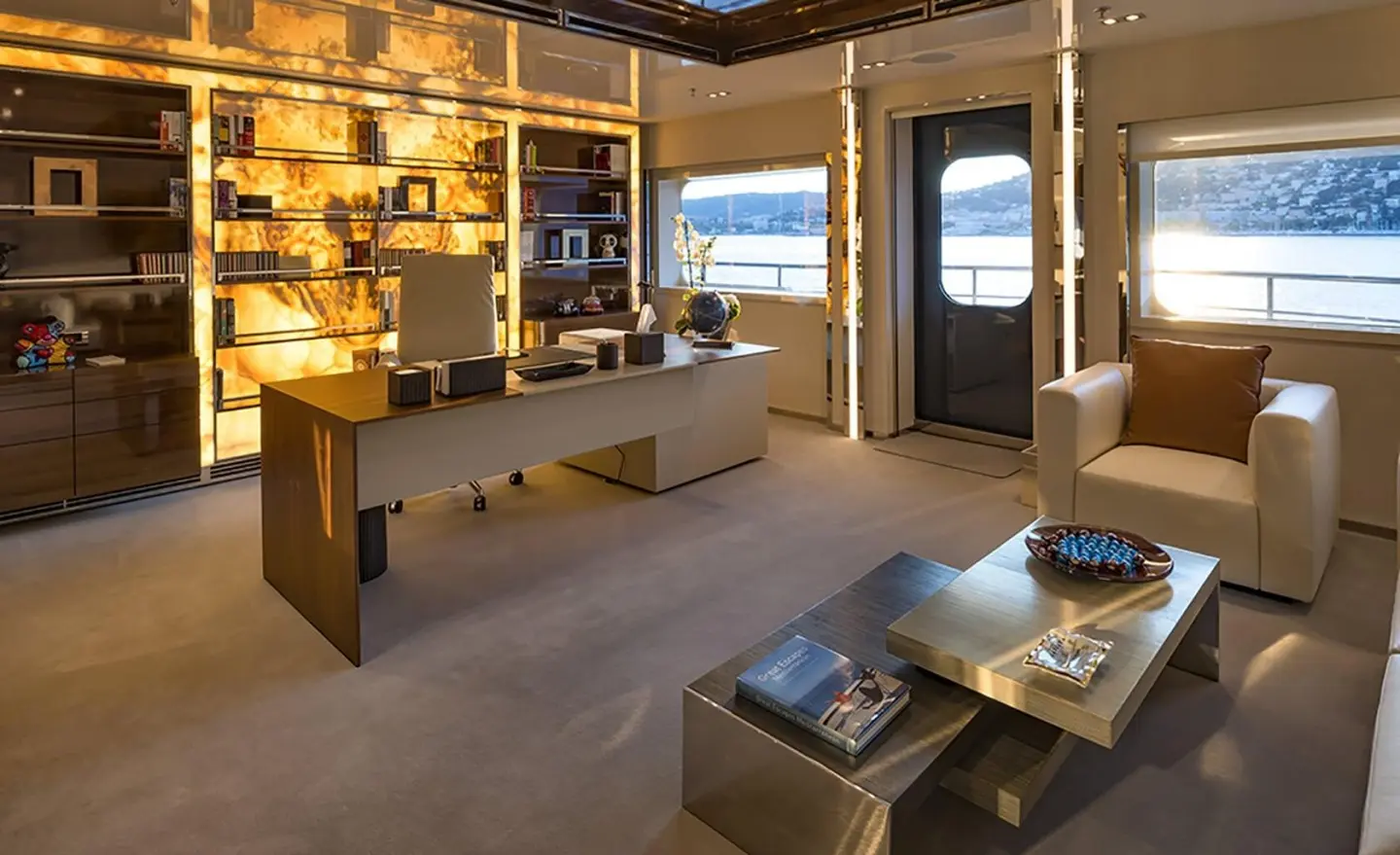 Marquise motor yacht interior lounge with wood paneling and large TV screen