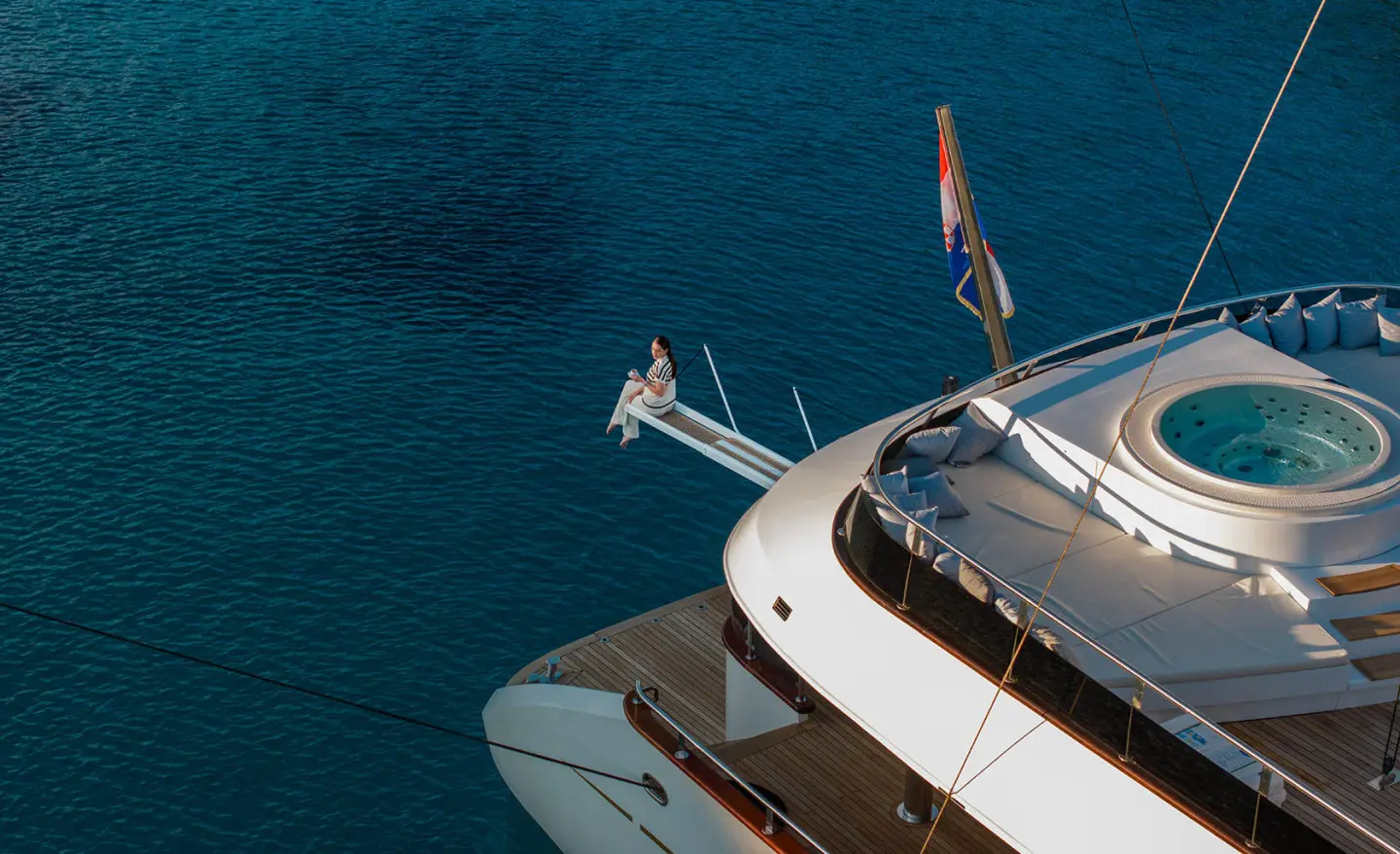 Anima Maris yacht anchored with deck and water visible from above