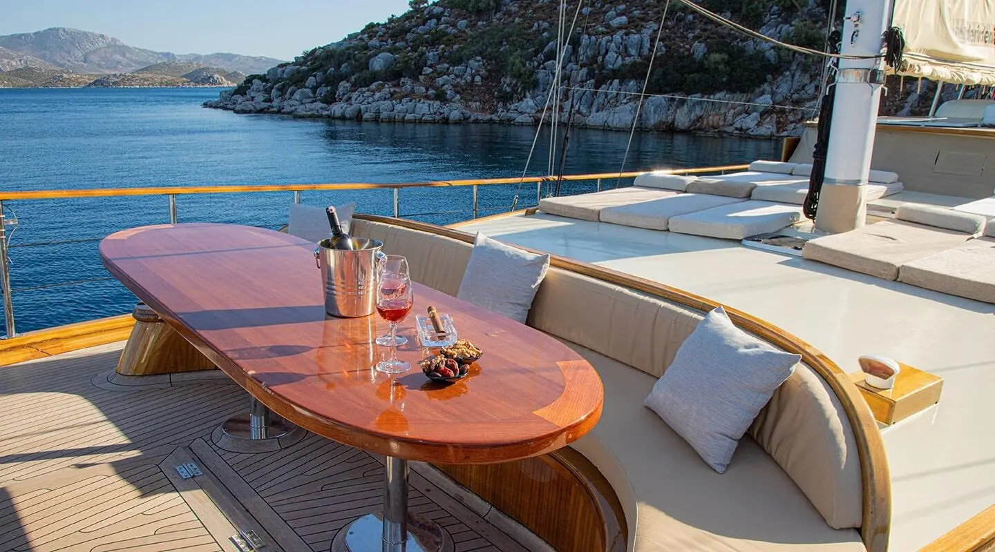 Bow deck of Derin Deniz gulet with orange seating and blue cushions