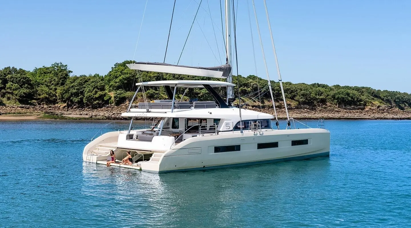 Daiquiri motor yacht anchored at a dock with cabin windows and upper deck