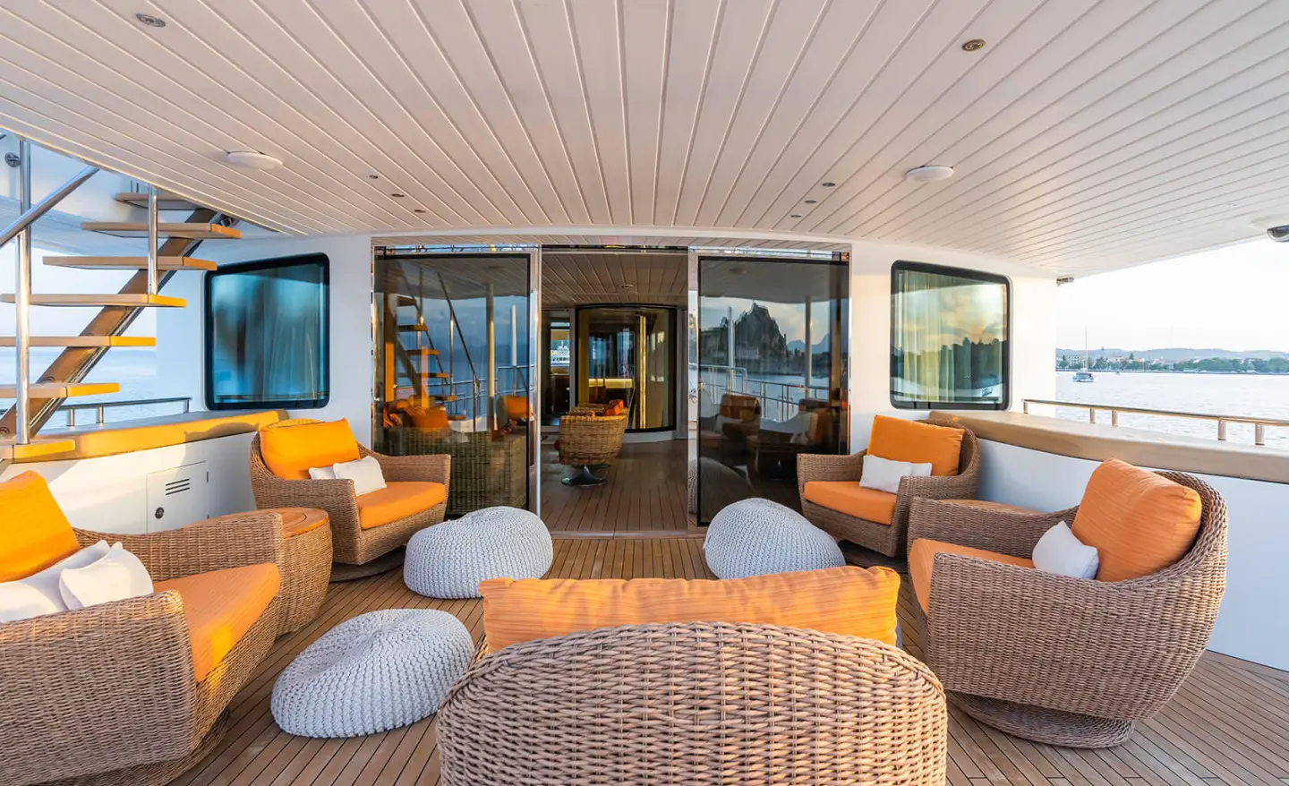 Serenity yacht deck seating area with wicker furniture and cushions