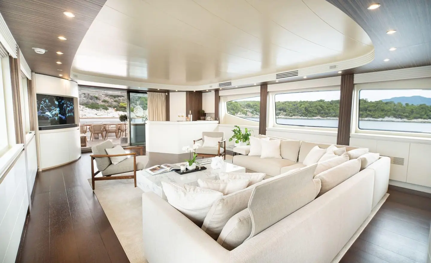 Pareaki II motor yacht saloon with comfortable seating and large windows
