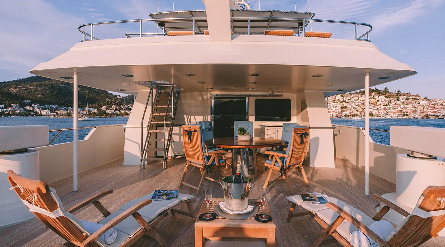 View from the yacht cockpit on Magix, outdoor dining area with people