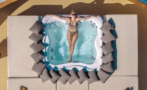 Top-down view of a luxury yacht Karizma with a hot tub surrounded by loungers