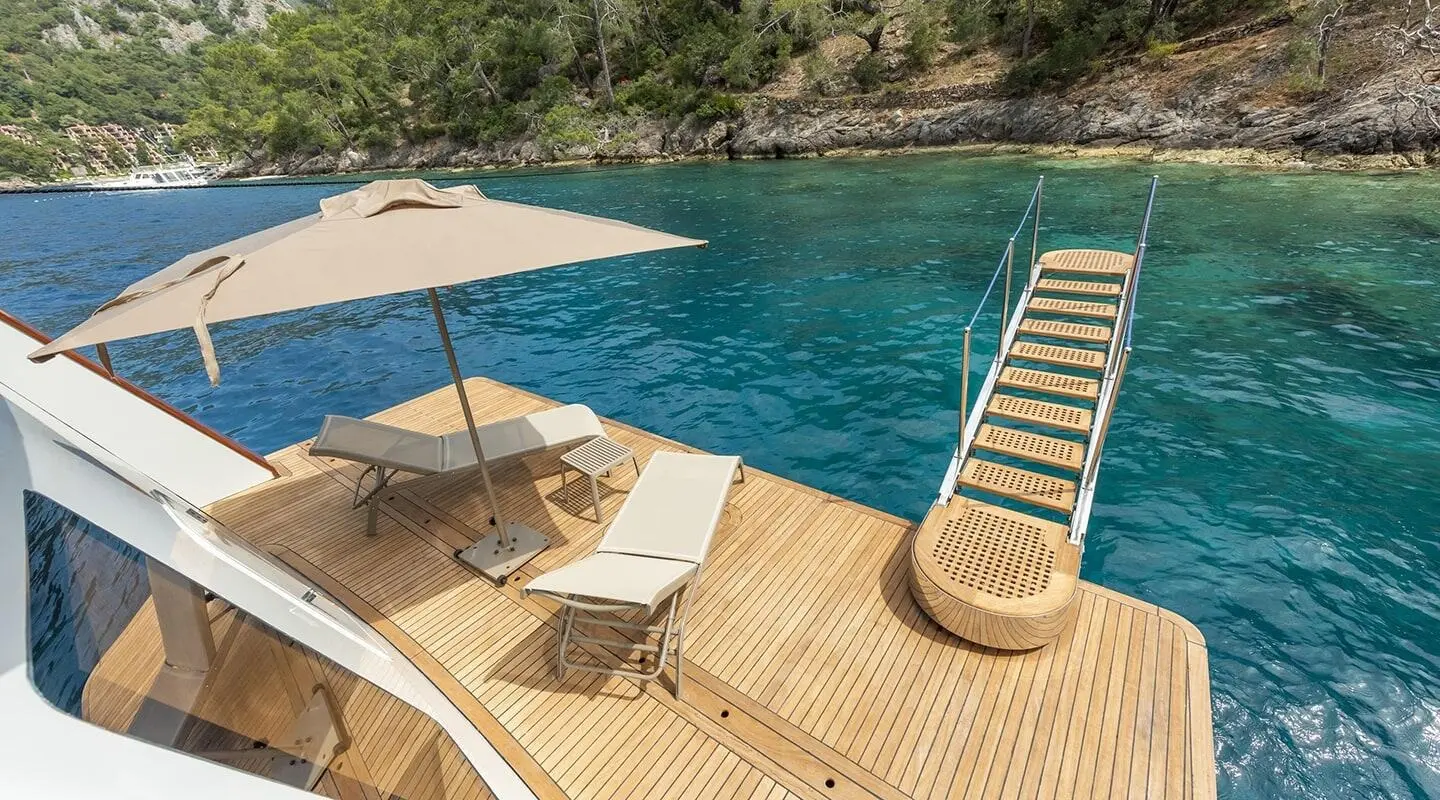Simay M yacht swim platform and deck with sun loungers and canopy