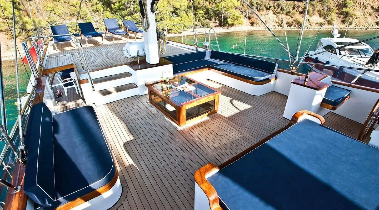 Maske 2 yacht exterior with wooden deck, seating area and glass coffee table