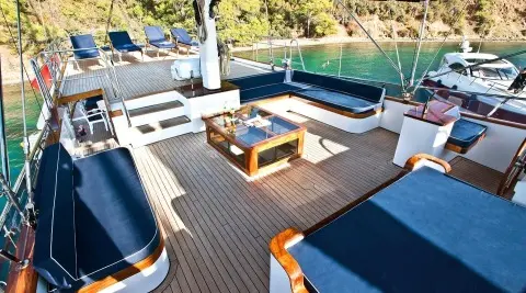 Maske 2 yacht exterior with wooden deck, seating area and glass coffee table