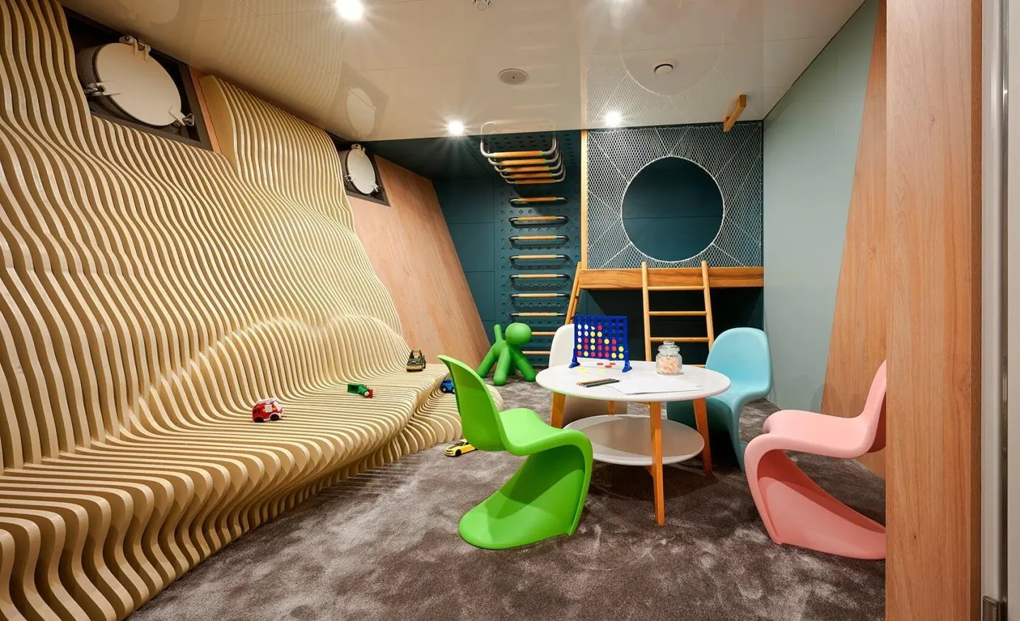 Interior of luxury yacht Ohana playroom with colorful seating and toys