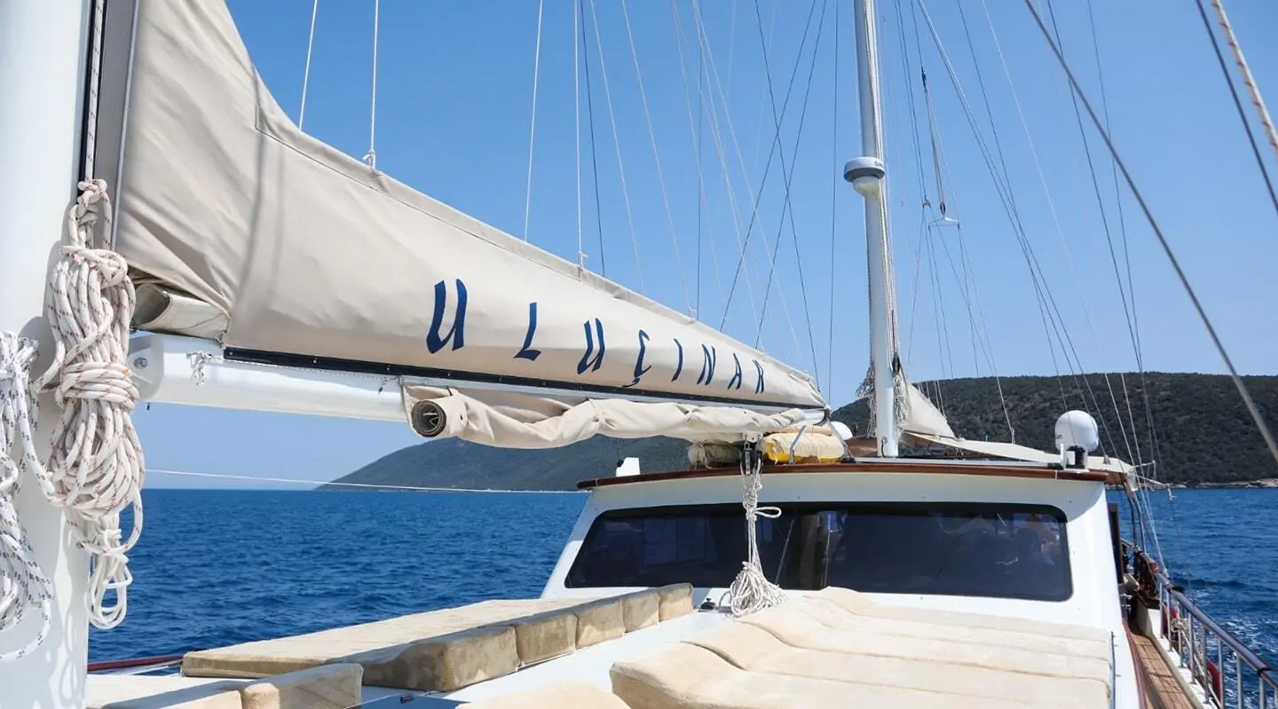 Gulet Ulucinar on the side deck with windows, ropes and blue sea view