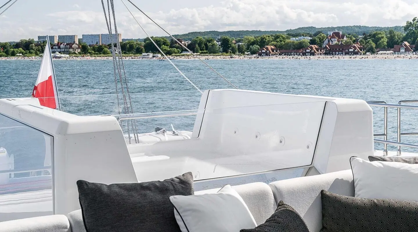 Yacht Above & Beyond flybridge with white seating and railing structure
