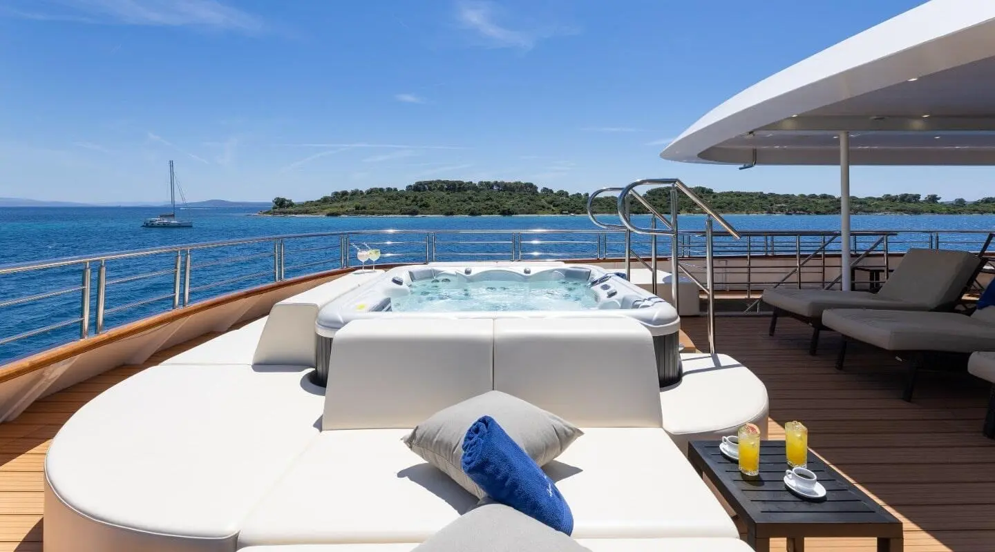 Sun deck of Queen Eleganza motor yacht with cushioned seating