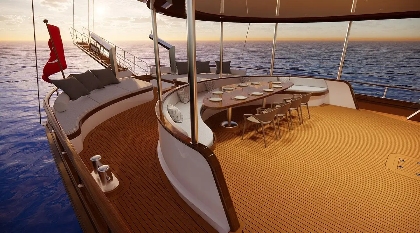Tosca yacht deck at sunset with railing and shadowed seating area