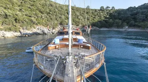 Grace 1 yacht bow view at sunset with rigging and calm blue sea
