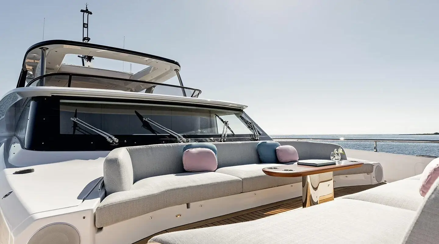 Viva II motor yacht bow deck with seating, cushions, and ocean backdrop