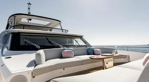 Viva II motor yacht bow deck with seating, cushions, and ocean backdrop