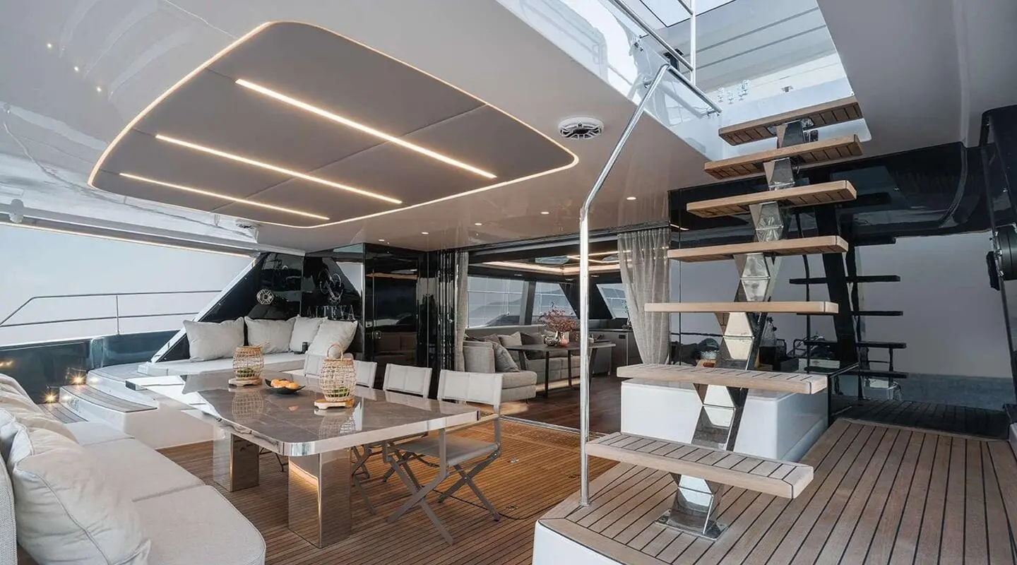 Aft deck of motoryacht Alteya with seating, wood decking, and shaded lounge area