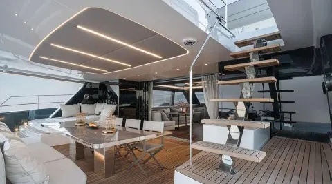 Aft deck of motoryacht Alteya with seating, wood decking, and shaded lounge area