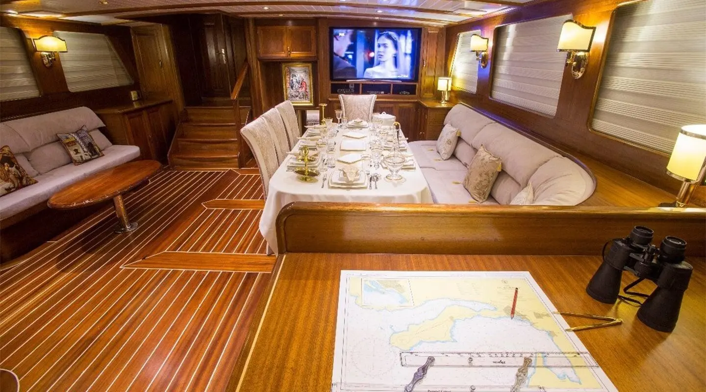 Interior of Ece Berrak luxury yacht with plush seating and dim lighting