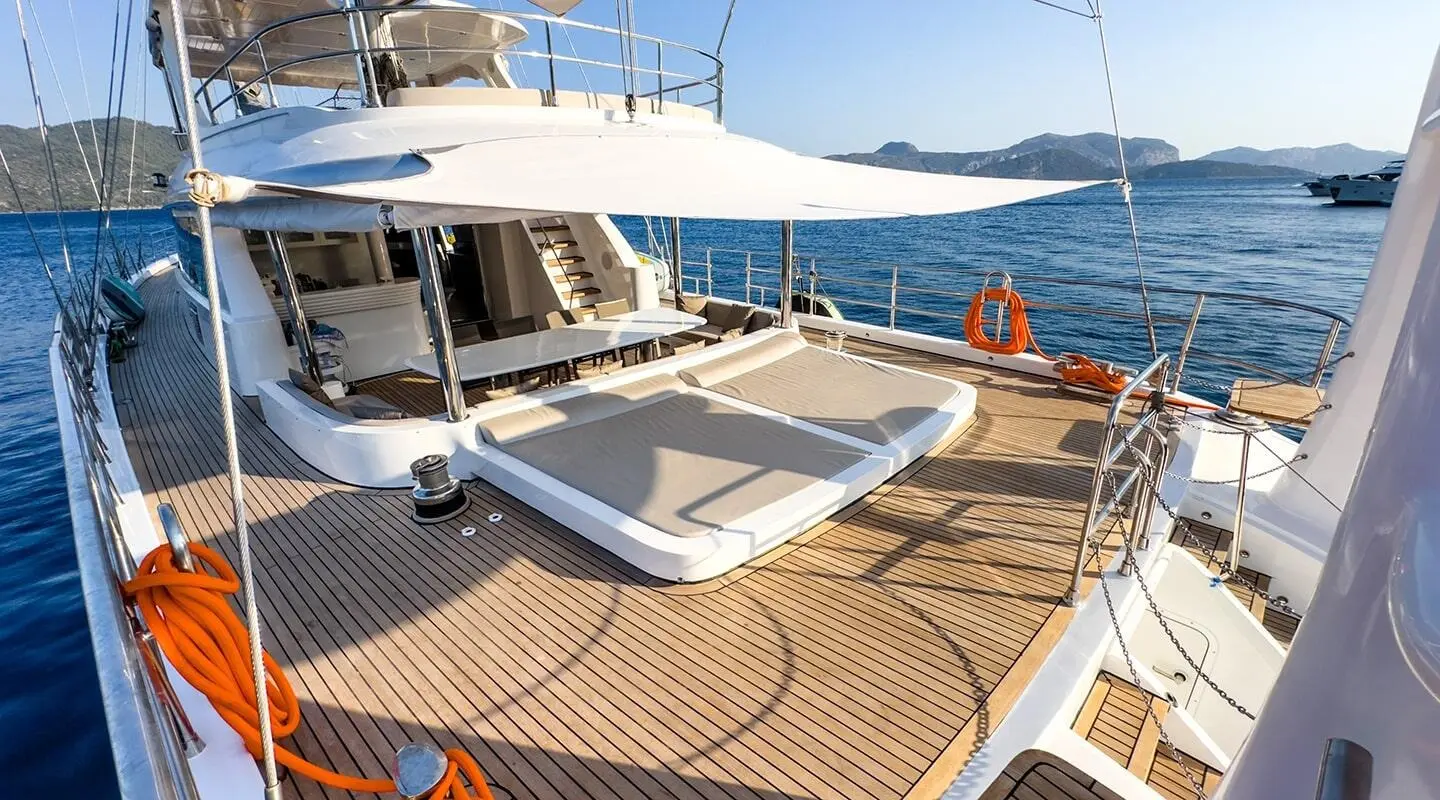 Gulet Angelo III aft deck with sun loungers on wooden deck