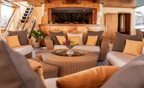 Seagull II yacht deck lounge with cushioned seating and warm ambient lighting