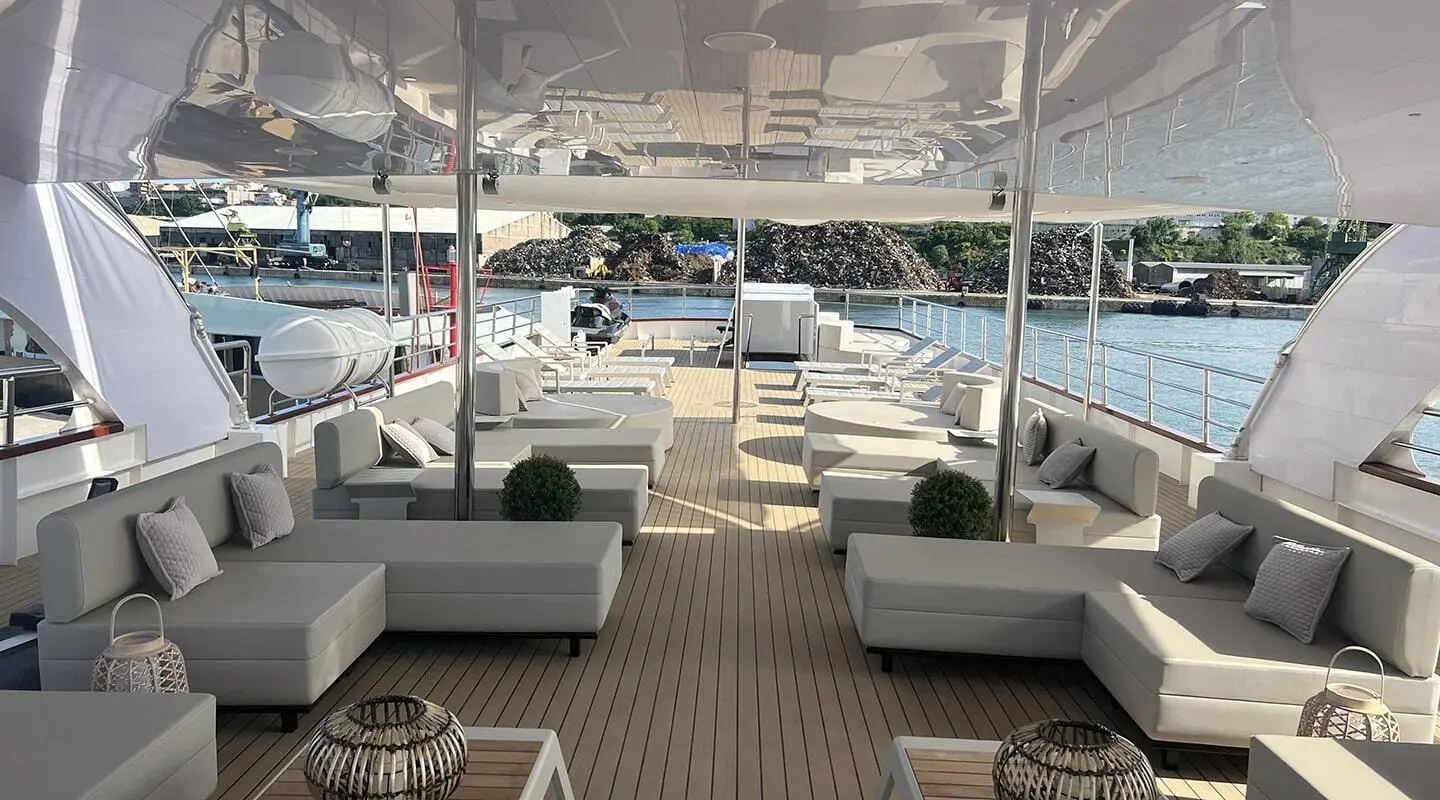 Melody yacht sun deck view with lounge seating and marina beyond